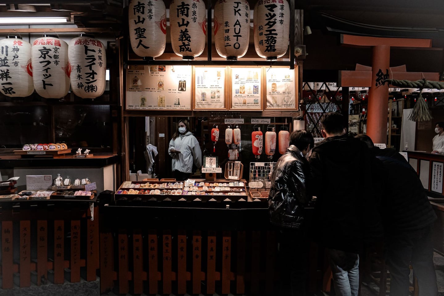 Explore the vibrant street food scene at a traditional Kyoto night market with paper lanterns and bustling stalls.