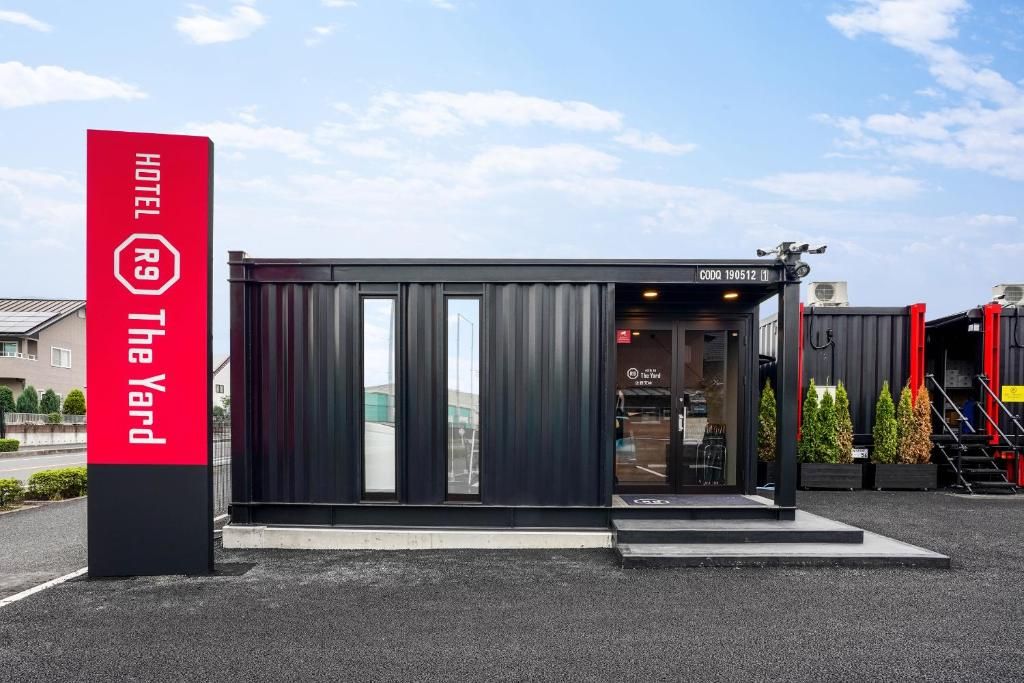 Exterior of the container rooms at HOTEL R9 The Yard Sano Tenjin